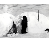 Iglu with snow shovel (puarik)